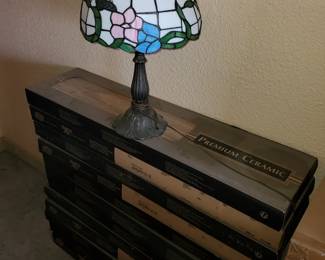 lamp and stack of wood flooring