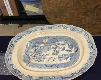 Wonderful old blue willow meat platter that professional movers broke. I, sadly glued it together. Diminished its value but still somewhat beautiful. 
