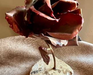 Metal rose on marble base