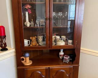 Corner curio cabinet with storage