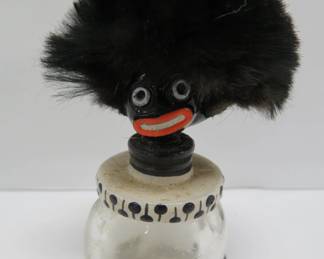Golliwog perfume bottle, top is fused