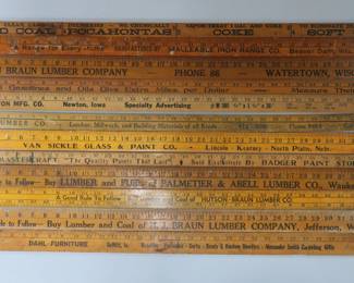 several lots of wooden advertising yardsticks, part of collection