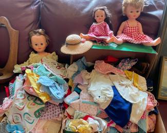 Assortment of Dolls and Doll Clothing