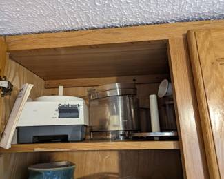 Cuisinart with blade and slicer attachments. Extra container.