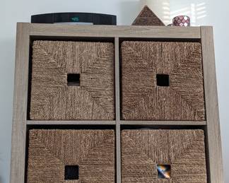 Bookshelf with Idea wicker slide-in baskets.