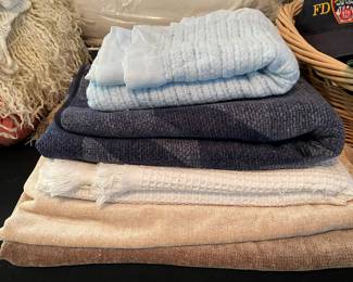 Assortment of Throw Blankets and Throw Pillows