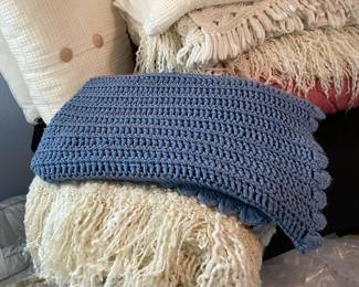 Assortment of Throw Blankets and Throw Pillows