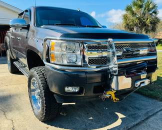 2010 Chevy Silverado LTZ Rocky Ridge Pkg - Vin 3GCRKTE29AG216598. V8. 6.2 liter. K1500. 4WD. Dark Grey. 6" lift provided by Rocky Ridge. Sliding moon roof. Sliding back window. Real full size spare tire. Warn winch mounted on the brush guard. Tool box. Heavy duty rear axel. Premium stereo system. DVD players in the back of seats. Back up Camera. Super clean interior. High speed wheel alignment done at Baughn alignment, New Shocks, new tie rods, new ball joints on front end & new brakes. $19,700 Firm