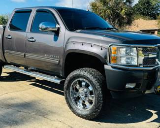 2010 Chevy Silverado LTZ Rocky Ridge Pkg - Vin 3GCRKTE29AG216598. V8. 6.2 liter. K1500. 4WD. Dark Grey. 6" lift provided by Rocky Ridge. Sliding moon roof. Sliding back window. Real full size spare tire. Warn winch mounted on the brush guard. Tool box. Heavy duty rear axel. Premium stereo system. DVD players in the back of seats. Back up Camera. Super clean interior. High speed wheel alignment done at Baughn alignment, New Shocks, new tie rods, new ball joints on front end & new brakes. $19,700 Firm