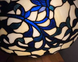 Blue and white leaded glass lamp shade on blue and white pottery base