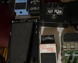Lots of guitar foot pedals, chromatic tuner, the rat, super chorus & so much more