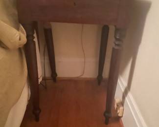 . . . another antique table being used as a night stand