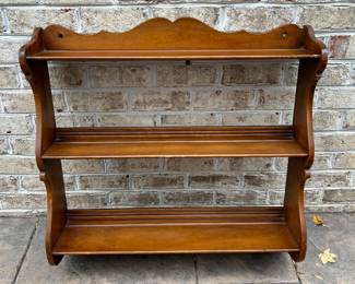 Wall hanging shelf with place for plates. 