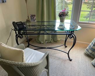 . . . glass and wrought-iron library table