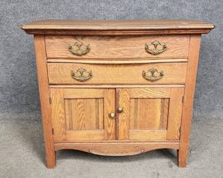 $240 - Wm H Happle Antique Oak 2 Drawer 2 Door Washstand Server Buffet GH-4                                                        A quaint Victorian Era Washstand. Made from oak with one dovetailed drawer featuring ornate brass hardware and lower cabinet for storage. 

Dimensions: 32 x 19 x 29"H

Local pick up Lorton, VA.  Contact us for shipper suggestions.