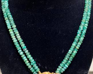 Hand strung emerald necklace with 18k gold and emerald clasp. 