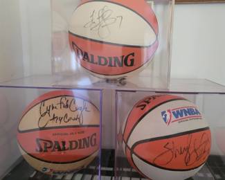 Signed Basketballs in case by 
Cynthia Cooper • Tina Thompson • Sheryl Swoopes