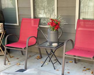 set of red and brown outdoor chairs and glass side table, wood and ceramic plant stands