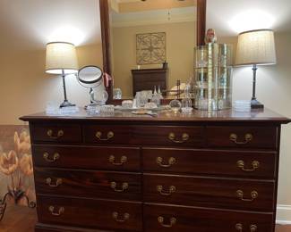 wooden dresser, tulip wall art painting, table lamp set, face mirror, jewelry box, jewelry storage