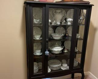 China cabinet and fine china, clock, glass curios, rose area rug