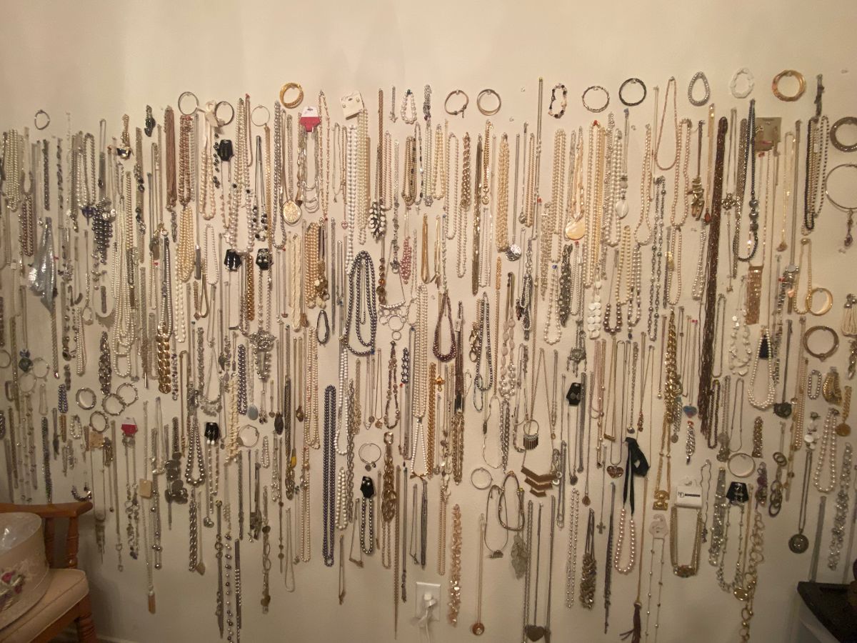 Lots of custom jewelry and custom pearls and other materials in this wall of jewelry!