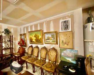 Antique chairs and canvas paintings. 