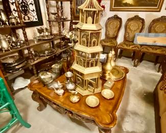 Lots Brassware pieces in this room and silver plated dishes platters pitchers and saucers. 