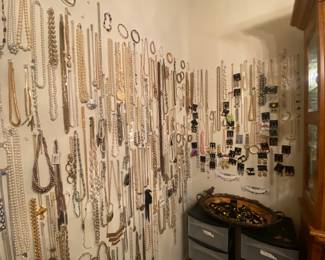 Lots of earrings on the basket and the wall!