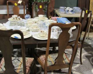 More Nice china on a QA table w/ 8 chairs. 