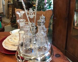 Silver plate Cruet set.  Missing stopper. Caps for Salt and Pepper not original.  Belonged to owners grandmother.
