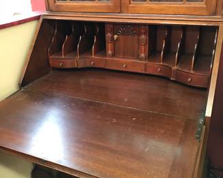 Secretary has secrete compartments that pull out. Beautiful fretwork.  Excellent condition.