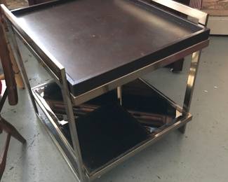 Love these brass, leather end tables with mirror shelf.  Style can fit anywhere.