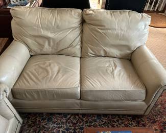 A PAIR OF THESE LEATHER LOVESEATS.