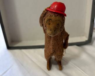 The cutest little wind-up monkey with a hat and cane! In excellent condition for its age. About 4" tall.