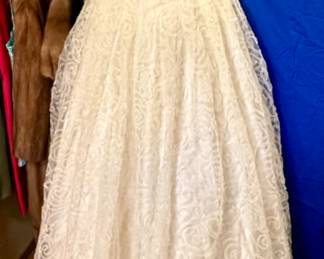 Beautiful Augusta Jones wedding dress and veil. Has been preserved and boxed. Excellent Condition! Size 16 altered. Probably closer to a 10-12 in off the rack sizes.