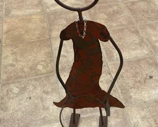 Metal worked statue. She’s about three feet tall. 