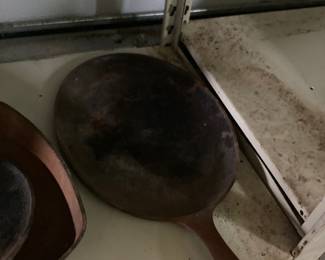 We have a large selection of cast iron skillets, etc.  Four shelves full in the shop