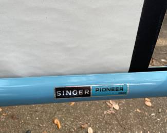 Singer Pioneer projection screen 
As is small tear.    $45.00