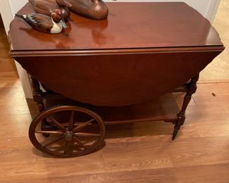 Wood tea cart with drop leaf sides
38”w 20”d 29”t.  44”d when leafs up
$95.00
