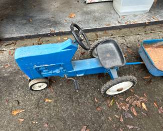 Vintage Cast Aluminum Ford Pedal Tractor with wagon.   $250.00