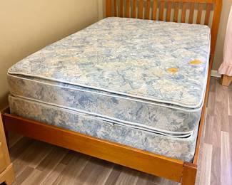 Full Size Wooden Bed with headboard and frame, includes mattress.