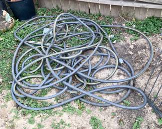 Heavy rubber garden hose.