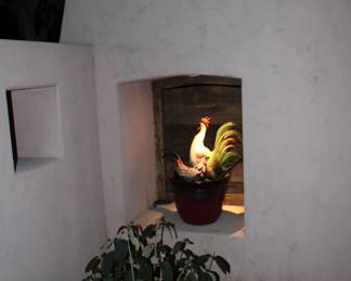 Chicken rooster and garden pot ( back patio)