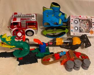 R/C Firetruck $10; Booster Bouncing Boots $10; Gabba Goods Bluetooth Headphone and Speaker NIB $12; Dyson Ball Toy Vacuum $15; Hot Wheels City Dragon Drive and Stunt Car Ramp Set $20