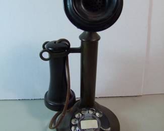 Lot 81:  C/1920 Brass Western Electric Candlestick Telephone with dialer, original finish, 12 1/2" h. x 7" dia.  Cond:  Moderate wear from use.  Est. $125 - 150.