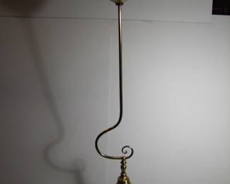 Lot 38: C/1890 Hanging brass oil lamp, converted to electric, gravity fed with upper reservoir. 7" X 6" X 44"h. Purchased from Materials Unlimited. Cond:  Polished, lacquered and entirely rewired.  Reservoir has old repairs and dents. Est. $125 - 175.