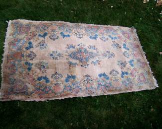 Lot 56:   Semi-Antique Kirman Wool Rug, Mauve field w/scroll and floral borders, 3' x 5'3".  Cond: End fringes heavily worn, some long edge wear. Est. $ 60 - 100.