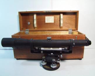 Lot 85: C/1950 Lietz 18" Dumpy  level (model 180) in dovetailed mahogany case, includes sun cover, 33X magnification, marked "Ohio University CE".  Case measures 20" x 7" x 10" with leather carry strap.  Cond:  Case shows wear on top edges.  Est. $100-200.