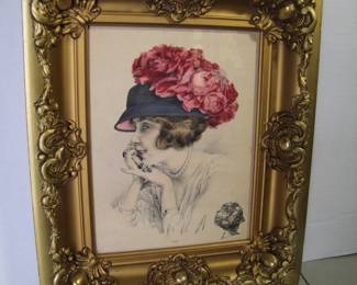 Lot 41:  C/1915 French Hand tinted Hat Illustration marked "Atelier Bachwitz", 9" x 12" h. in a French gilt frame, 14" x 17".  Cond:  No damage to print, frame has corner touch ups and small losses.  Est. $40 - 60.