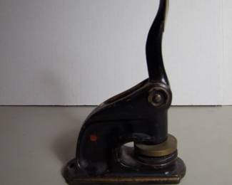 Lot 84: C/1900 Cast Iron Notary Public stamp, brass die, 8" x 5" x 2".  Cond:  Moderate wear from use.              Est. $25 - 50.